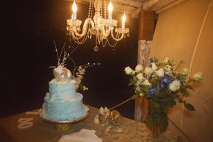 Picture of wedding cake and chandelier at Kukua Beach Club Punta Cana