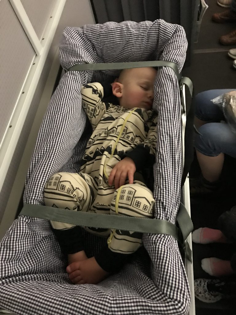 Picture of Baby in Cot on Plane