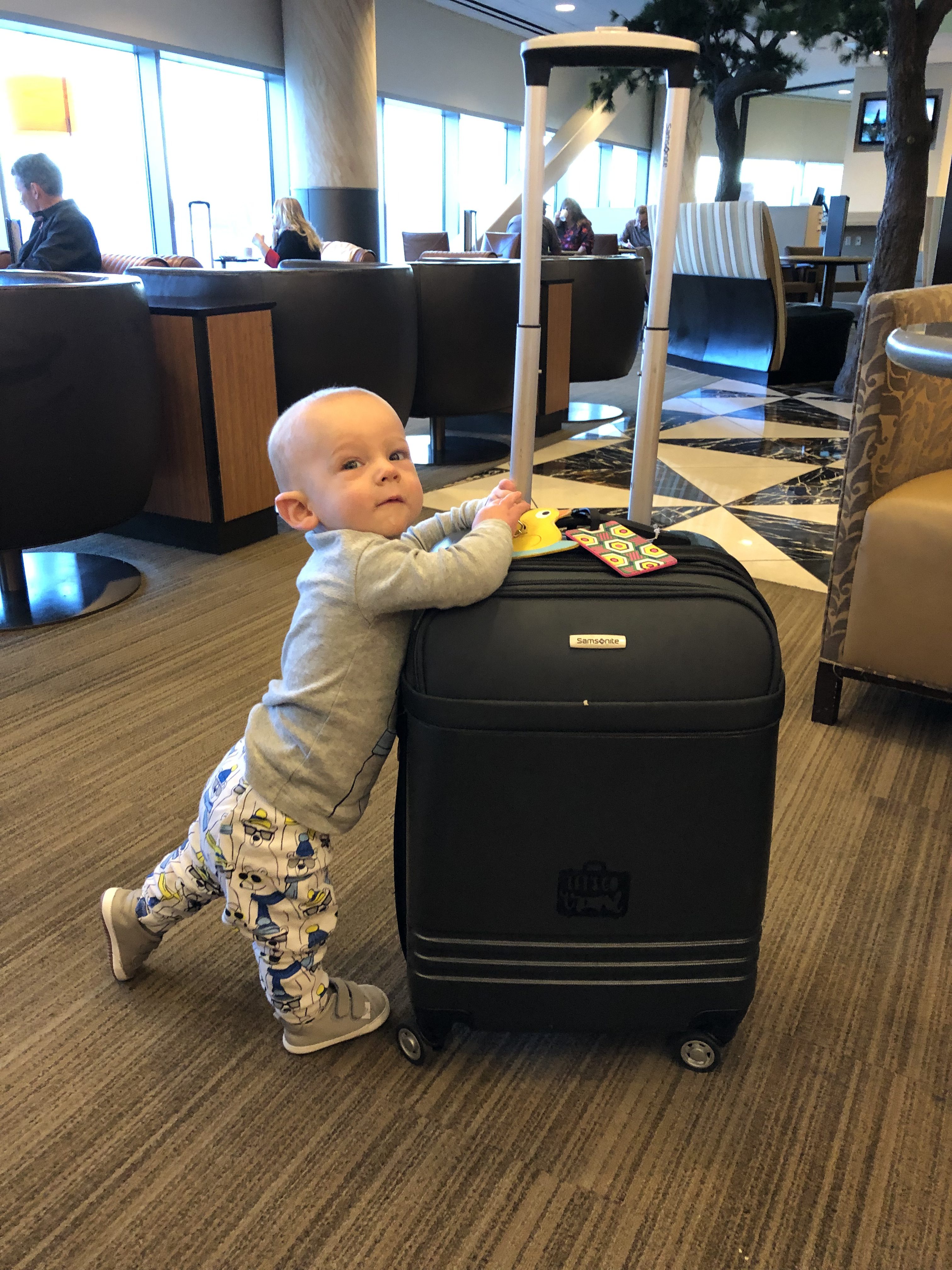 Picture of Baby Next to Luggage